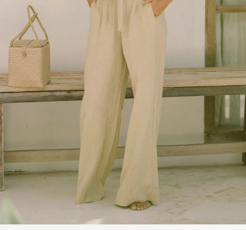 Light beige linen wide-leg trousers for women by Christine Brewer, featuring a loose pull-on style and relaxed fit.