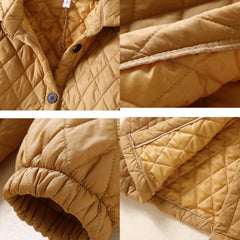 Longline women’s puffer jacket by Christine Brewer, Elena style, featuring a sleek, insulated design ideal for cold weather.