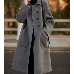 Green long wool coat for women by Christine Brewer, featuring a stylish and warm design with a tailored fit.