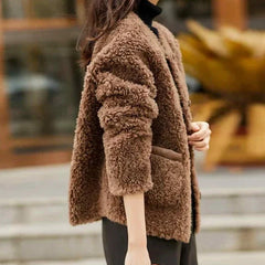 Emily glamorous faux fur coat for women by Christine Brewer, featuring soft plush fur and stylish design.