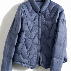 Women’s Aurora short quilted puffer jacket by Christine Brewer, featuring a stylish quilted design and cozy, insulated fit.
