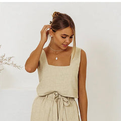 Women’s linen wide-leg trousers by Christine Brewer, loose pull-on pants with a relaxed fit and natural fabric appearance.