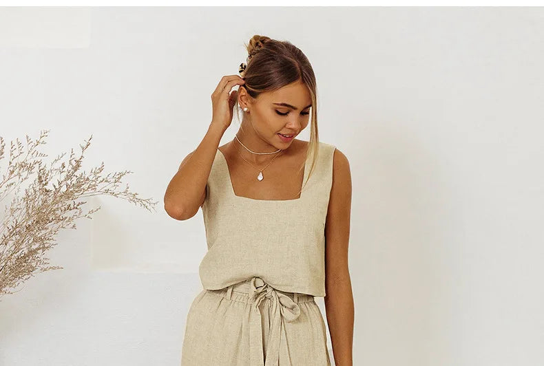 Women’s linen wide-leg trousers by Christine Brewer, loose pull-on pants with a relaxed fit and natural fabric appearance.