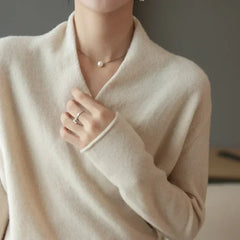 Pink cashmere V-neck sweater for women from Christine Brewer's Gwen collection, featuring soft, cozy fabric and a flattering fit.