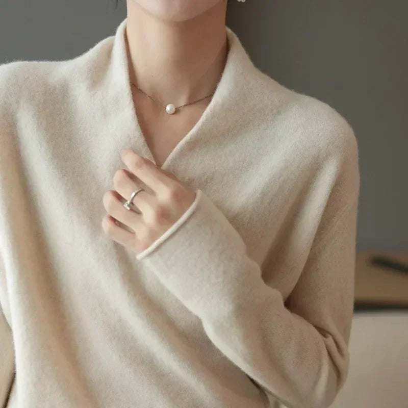 Pink cashmere V-neck sweater for women from Christine Brewer's Gwen collection, featuring soft, cozy fabric and a flattering fit.