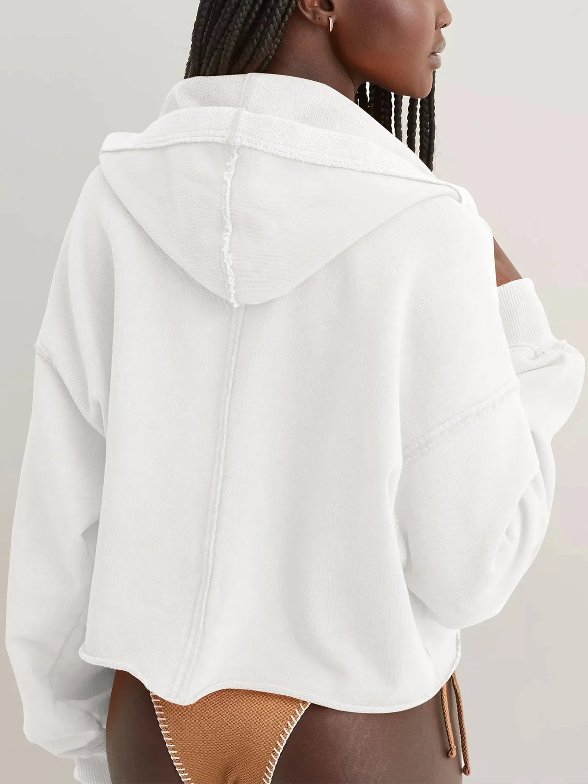 Eleanor cropped hoodie for women by Christine Brewer, shown in soft fabric with a relaxed fit, featuring a hood and long sleeves.