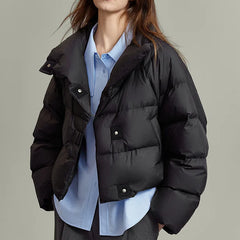 Hannah cropped quilted parka for women by Christine Brewer, showcasing a stylish, insulated outerwear with quilted pattern and hood.