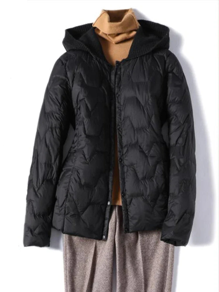 Women’s Zoe quilted puffer jacket with hood by Christine Brewer, featuring a stylish quilted design and warm, insulated fabric.