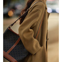 Green long wool coat for women from Christine Brewer, featuring a stylish and cozy design, displayed on a model.