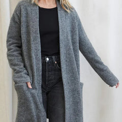Women’s Jacqueline Merino wool cardigan by Christine Brewer, featuring a cozy, stylish knit design and front button closure.