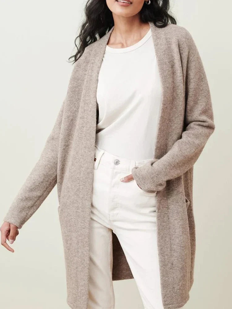 Woman wearing the Jacqueline merino wool cardigan for women by Christine Brewer, featuring a cozy, stylish knit design.