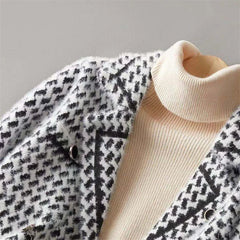 Isabella Christine Brewer cropped double-breasted knit cardigan for women, showing the fitted design and button details.