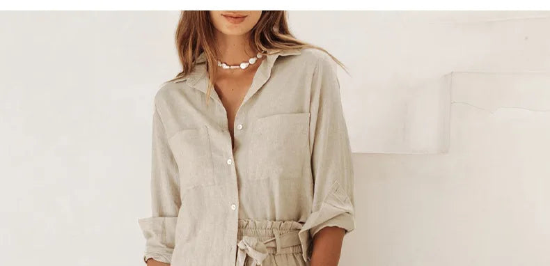 Women’s linen wide-leg trousers by Christine Brewer, loose pull-on pants with relaxed fit and flowing fabric, displayed on a model.