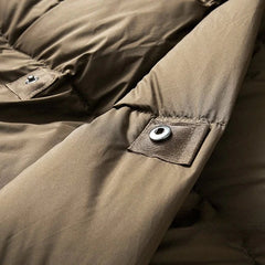 Long hooded women's parka from Christine Brewer's Ava collection, featuring a stylish design and cozy hood for cold weather.