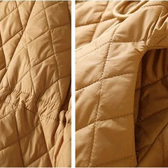 Longline puffer jacket for women by Christine Brewer, featuring a stylish, insulated design ideal for cold weather.