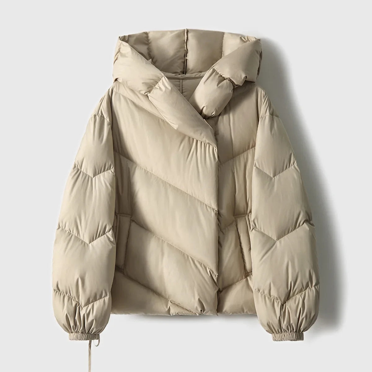 Women’s cropped hooded puffer jacket by Christine Brewer, featuring quilted design and cozy hood for stylish winter warmth.