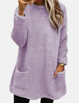 Christine Brewer Estelle knit sweater for women, soft beige sweater with a cozy fit and ribbed cuffs, styled on a model.