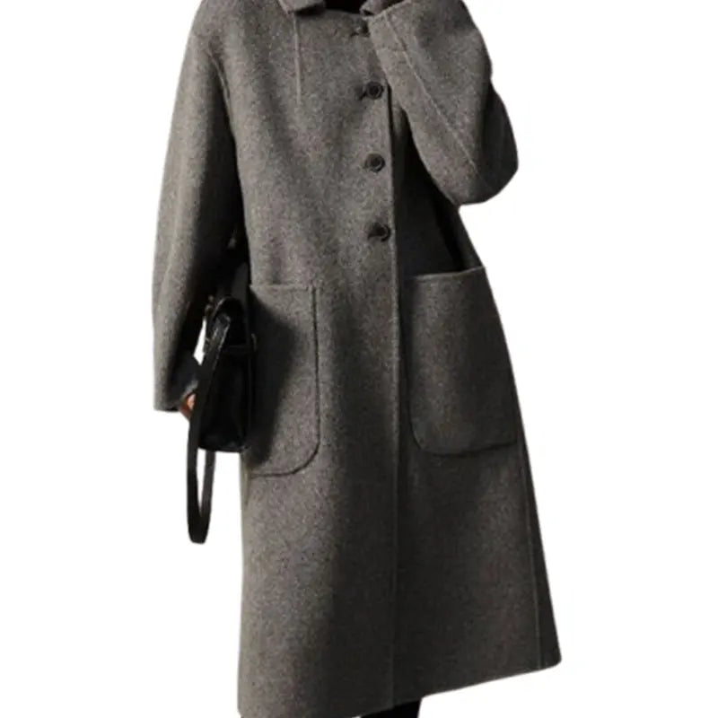 Green long wool coat for women by Christine Brewer, featuring a stylish and cozy design with a tailored fit and classic collar.