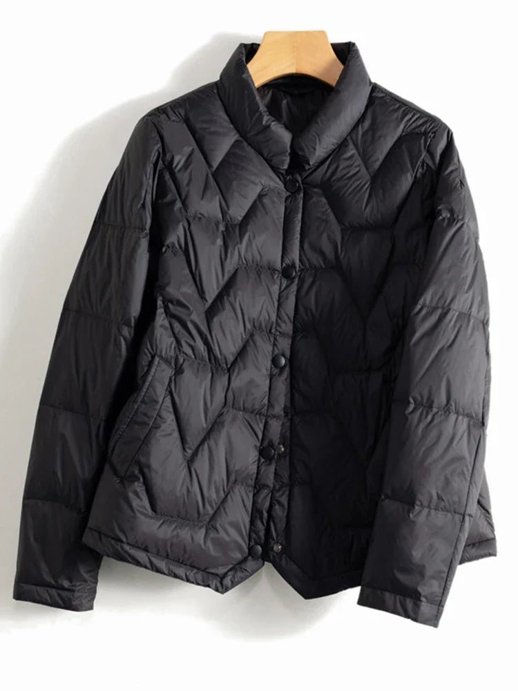 Women’s Aurora short quilted puffer jacket by Christine Brewer, featuring a stylish quilted design and cozy padded construction.