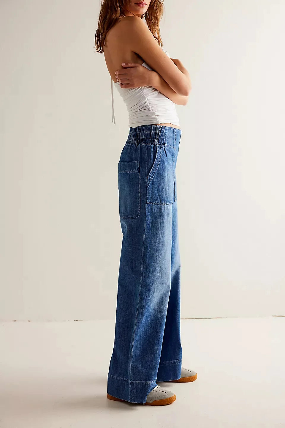 Blue denim wide-leg women's jeans by Christine Brewer featuring relaxed fit and classic denim style.