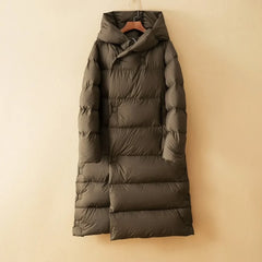 A woman wearing the Christine Brewer Ava long hooded parka, featuring a cozy hood and stylish design for cold weather.