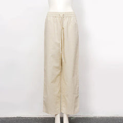 Women’s cotton linen wide-leg drawstring trousers by Christine Brewer, loose pull-on pants with relaxed fit and comfortable design.