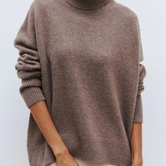 Cream-colored Erica oversized turtleneck sweater for women by Christine Brewer, featuring a cozy knit design.