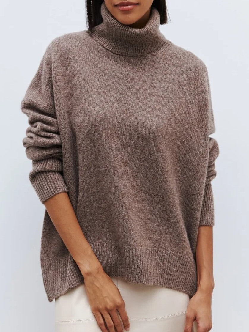 Cream-colored Erica oversized turtleneck sweater for women by Christine Brewer, featuring a cozy knit design.