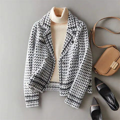 Isabella women's cropped double-breasted knit cardigan by Christine Brewer, displayed on a hanger with button details and ribbed cuffs.