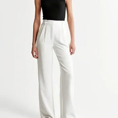 White wide-leg high-waist trousers for women by Christine Brewer, featuring a stylish high-waist design and relaxed fit.