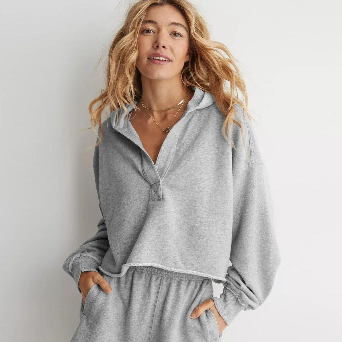 Women's cropped hoodie by Christine Brewer, Eleanor style, featuring a relaxed fit with a comfortable hood and stylish design.