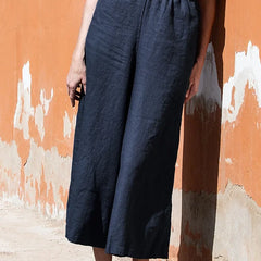 Women’s linen cropped wide-leg drawstring trousers by Christine Brewer, loose pull-on pants with relaxed fit and comfortable style.