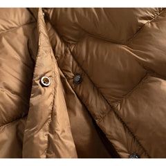 Pink Aurora short quilted puffer jacket for women by Christine Brewer, featuring a stylish quilted design and cozy fit.