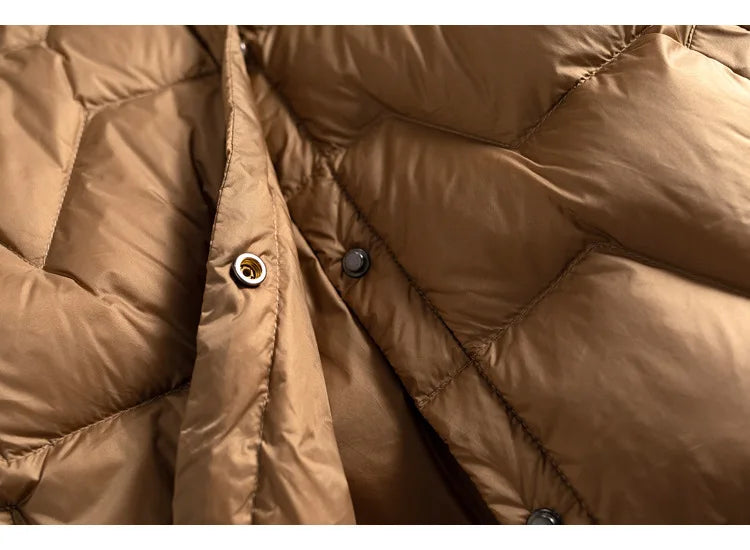 Pink Aurora short quilted puffer jacket for women by Christine Brewer, featuring a stylish quilted design and cozy fit.