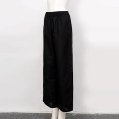 Women’s cotton linen wide-leg drawstring trousers by Christine Brewer, loose pull-on pants with relaxed fit and comfortable waistband.
