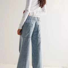 Blue denim wide-leg women's jeans by Christine Brewer, relaxed fit pants with a casual, stylish look.