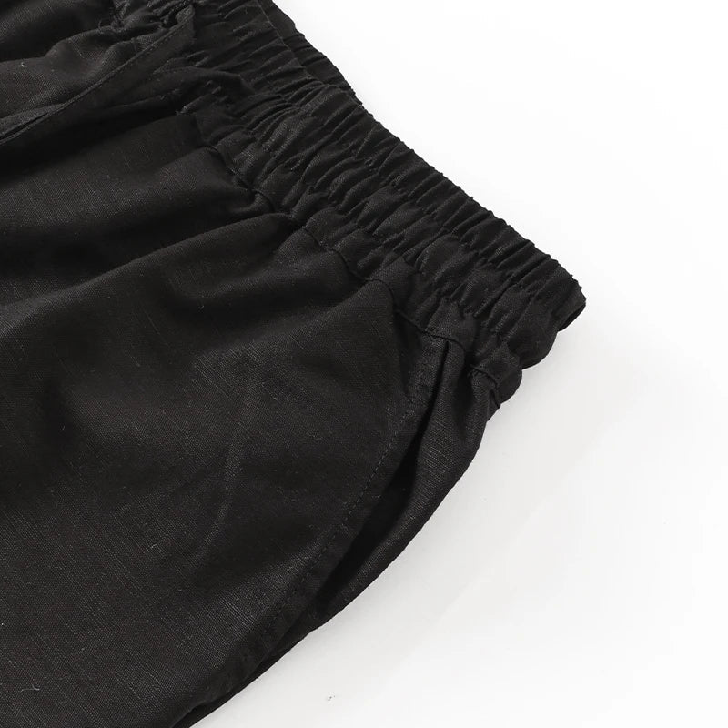 Women’s cotton linen wide-leg drawstring trousers by Christine Brewer, loose pull-on pants with relaxed fit and comfortable style.