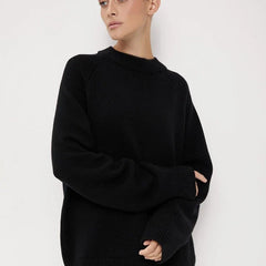 Oversized wool sweater for women by Christine Brewer, featuring a cozy, chunky knit in neutral tones, perfect for layered winter looks.