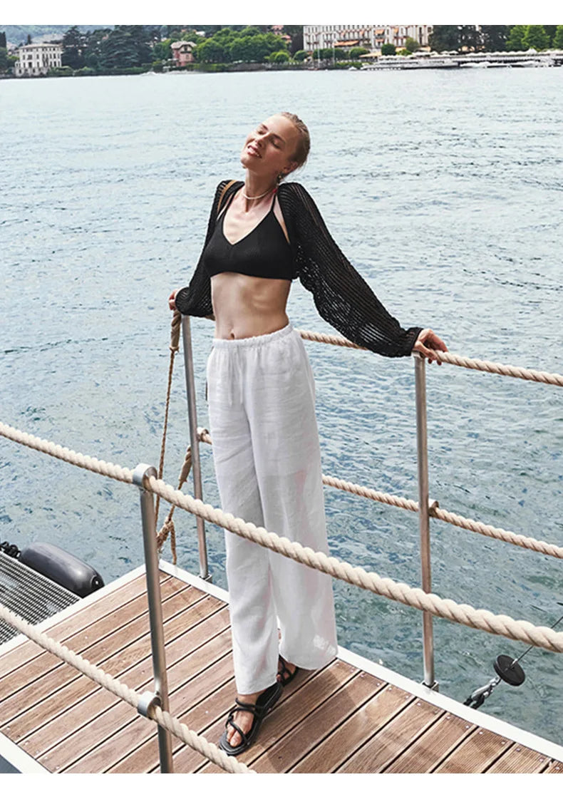 Women’s knit wide-leg drawstring trousers by Christine Brewer, loose pull-on pants, with a relaxed fit and comfortable waistband.