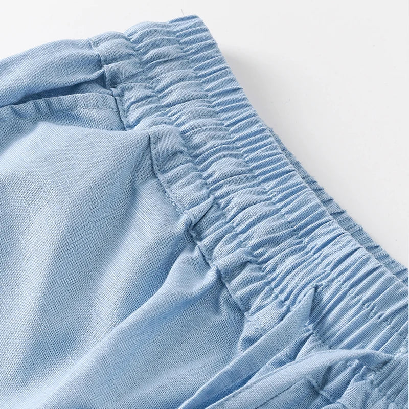 Women’s cotton linen wide-leg drawstring trousers by Christine Brewer, loose pull-on pants with relaxed fit and comfortable waistband.