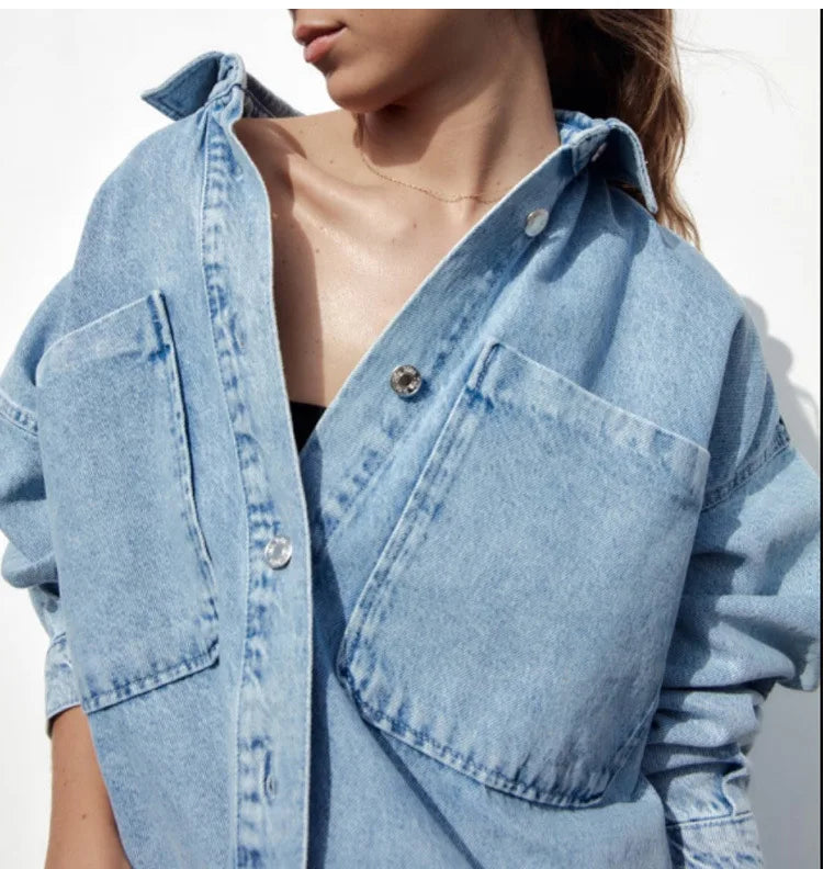 Nora relaxed denim shirt jacket for women by Christine Brewer, featuring classic blue denim with button closure and chest pockets.