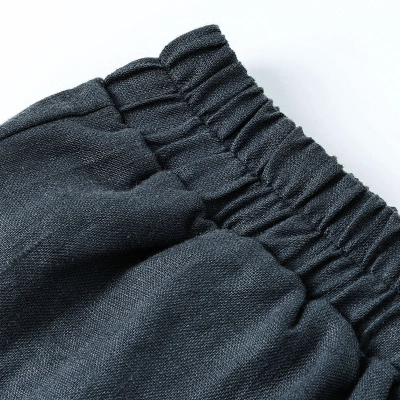 Linen cropped wide-leg drawstring trousers for women by Christine Brewer, featuring a loose pull-on style and relaxed fit.