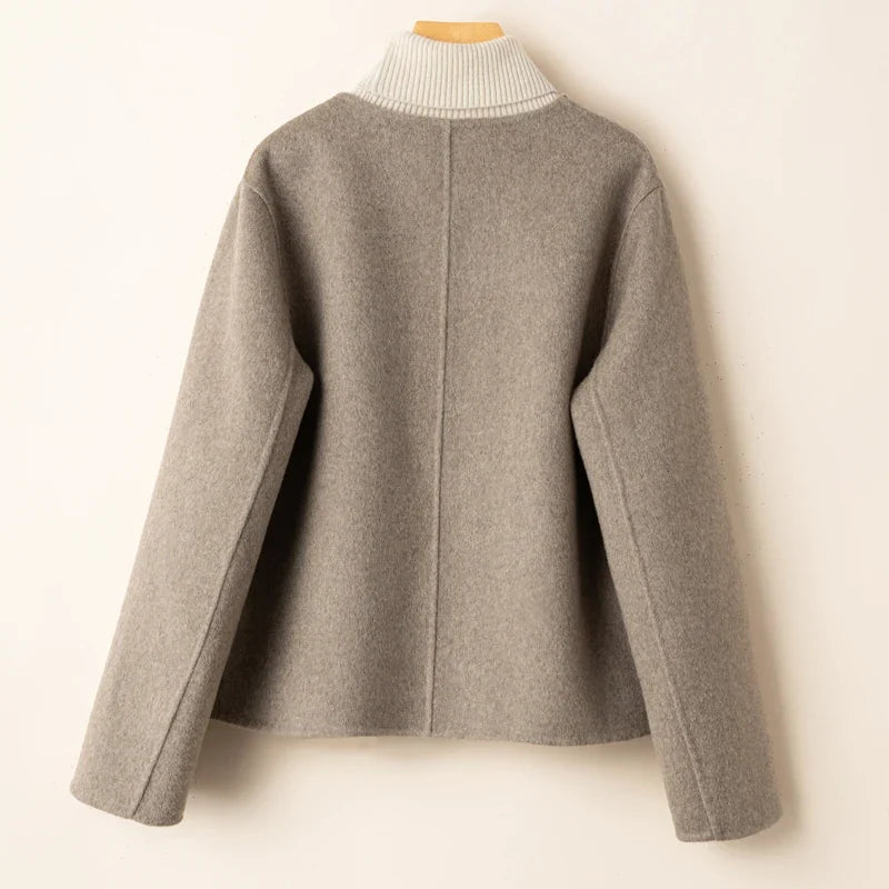 Evelyn wool coat for women by Christine Brewer, stylish and elegant in a classic design, shown in a neutral color.