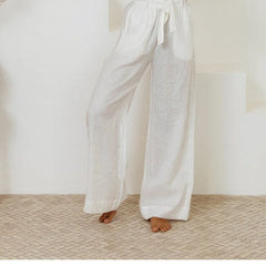Light beige linen wide-leg trousers for women by Christine Brewer, featuring a loose pull-on style and relaxed fit.