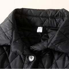 Longline puffer jacket for women, Elena by Christine Brewer, featuring a warm, quilted design with a hood and stylish silhouette.