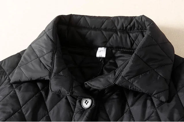 Longline puffer jacket for women, Elena by Christine Brewer, featuring a warm, quilted design with a hood and stylish silhouette.
