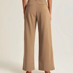 White wide-leg high-waist women's trousers by Christine Brewer, featuring a relaxed fit and tailored high-rise design.