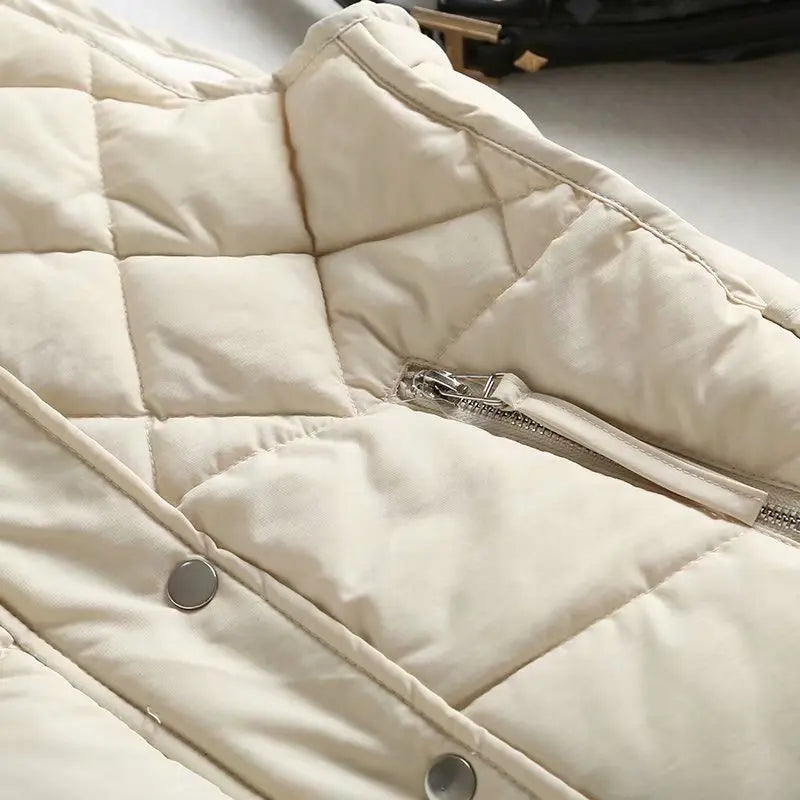 Ruby stand collar puffer vest for women by Christine Brewer, featuring a stylish quilted design and a stand collar for warmth.