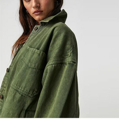 Oversized Charlotte denim shirt jacket for women by Christine Brewer, featuring classic blue denim with button closure and collar.