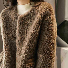 Emily glamorous faux fur coat for women by Christine Brewer, shown in a cozy, stylish design with plush fur texture.